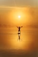silhouette-of-strong-man-paddling-on-sup-board-at-2022-08-26-15-21-59-utc